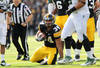 IOWA CITY, IA - NOVEMBER 12:  Marcus Coker #34 of the Iowa Hawkeyes is tackled against the Michigan State Spartans at Kinnick Stadium November 12, 2011 in Iowa City, Iowa. Michigan State beat Iowa 37-21.   (Photo by Reese Strickland/Getty Images)