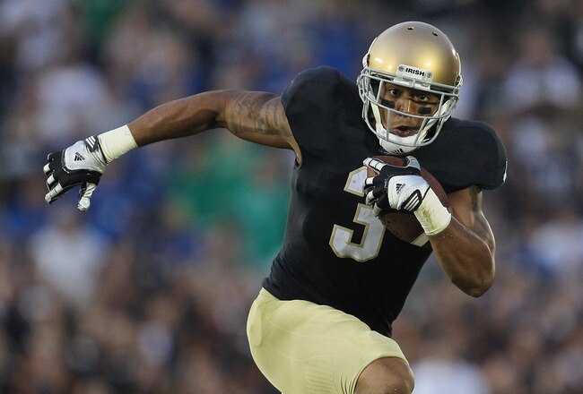 SOUTH BEND, IN - SEPTEMBER 03: Michael Floyd #3 of the Notre Dame Fighting Irish runs after catching a pass against the University of South Florida Bulls at Notre Dame Stadium on September 3, 2011 in South Bend, Indiana. South Florida defeated Notre Dame 23-20. (Photo by Jonathan Daniel/Getty Images)