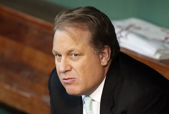BOSTON - APRIL 04:  Former Boston Red Sox pitcher Curt Schilling sits in the dugout before the home opener against the New York Yankees on April 4, 2010 during Opening Night at Fenway Park in Boston, Massachusetts.  (Photo by Elsa/Getty Images)