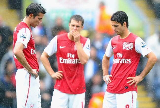 BLACKBURN, ENGLAND - SEPTEMBER 17: l-r Robin Van Persie, Aaron Ramsey and Mikel Arteta of Arsenal show their dissapointment after the fourth goal during the Barclays Premier League match between Blackburn Rovers and Arsenal at Ewood Park on September 17, 2011 in Blackburn, England.  (Photo by Laurence Griffiths/Getty Images)