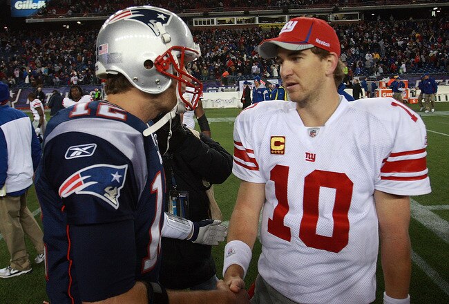 FOXBORO, MA - NOVEMBER 6:    Tom Brady #12 of the New England Patriots congratulates  Eli Manning #10 of the New York Giants after the New York Giants 24-20 win on November 6, 2011 in Foxboro, Massachusetts. (Photo by Jim Rogash/Getty Images)