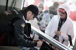 DAYTONA BEACH, FL - JANUARY 13:  Kurt Busch, driver of the #51 Phoenix Racing Chevrolet, signs autographs for fans during Daytona Preseason Thunder at Daytona International Speedway on January 13, 2012 in Daytona Beach, Florida.  (Photo by Jared C. Tilton/Getty Images for NASCAR)