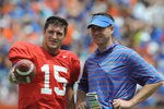 GAINESVILLE, FL - APRIL 18: Quarterback Tim Tebow #15 of the University of Florida talks with quarterbacks coach Scott Loeffler  during the spring football Orange and Blue game April 18, 2009 at Ben Hill Griffin Stadium in Gainesville, Florida.  (Photo by Al Messerschmidt/Getty Images)