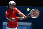 MELBOURNE, AUSTRALIA - JANUARY 23:  Kei Nishikori of Japan plays a backhand in his fourth round match against Jo-Wilfried Tsonga of France  during day eight of the 2012 Australian Open at Melbourne Park on January 23, 2012 in Melbourne, Australia.  (Photo by Quinn Rooney/Getty Images)