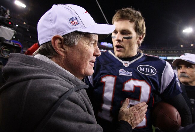 FOXBORO, MA - JANUARY 22:   Tom Brady #12 of the New England Patriots celebrates with head coach Bill Belichick of the New England Patriots after defeating the Baltimore Ravens in the AFC Championship Game at Gillette Stadium on January 22, 2012 in Foxboro, Massachusetts. The New England Patriots defeated the Baltimore Ravens 20-23.  (Photo by Elsa/Getty Images)