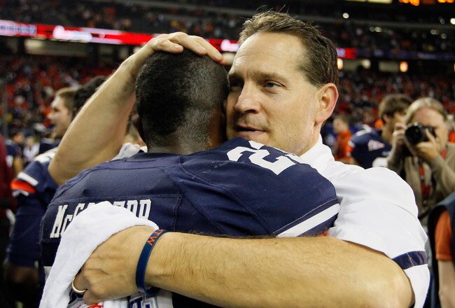 ATLANTA, GA - DECEMBER 31:  Head coach Gene Chizik of the Auburn Tigers celebrates with Onterio McCalebb #23 after their 43-24 win over the Virginia Cavaliers during the 2011 Chick Fil-A Bowl at Georgia Dome on December 31, 2011 in Atlanta, Georgia.  (Photo by Kevin C. Cox/Getty Images)