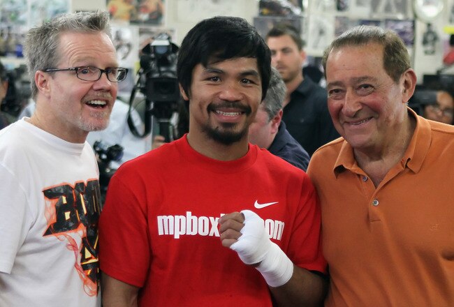HOLLYWOOD, CA - APRIL 20:  Manny Pacquiao of the Philippines (C) poses with his coach Teddy Roach (L) and promoter Bob Arum (R) during a media workout at the Wild Card Boxing Club on April 20, 2011 in Hollywood, California.  (Photo by Jeff Gross/Getty Images)