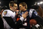 FOXBORO, MA - JANUARY 22:  Tom Brady #12 of the New England Patriots talks with Joe Flacco #5 of the Baltimore Ravens after defeating the Baltimore Ravens in the AFC Championship Game at Gillette Stadium on January 22, 2012 in Foxboro, Massachusetts. The New England Patriots defeated the Baltimore Ravens 20-23.  (Photo by Al Bello/Getty Images)