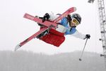 ASPEN, CO - JANUARY 31:  Marie Martinod-Routin of France grabs her skies above the halfpipe during the Women's Skiing Superpipe Finals at Winter X Games 10 on January 31, 2006 at Buttermilk Mountain in Aspen, Colorado.  (Photo by Brian Bahr/Getty Images)