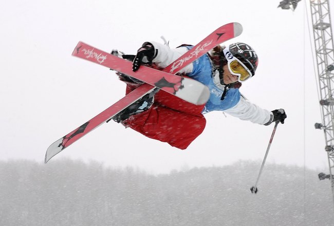 ASPEN, CO - JANUARY 31:  Marie Martinod-Routin of France grabs her skies above the halfpipe during the Women's Skiing Superpipe Finals at Winter X Games 10 on January 31, 2006 at Buttermilk Mountain in Aspen, Colorado.  (Photo by Brian Bahr/Getty Images)