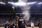 OAKLAND, CA - JANUARY 10:  LeBron James #6 of the Miami Heat throws chalk in to the air before their game against the Golden State Warriors at Oracle Arena on January 10, 2012 in Oakland, California.  NOTE TO USER: User expressly acknowledges and agrees that, by downloading and or using this photograph, User is consenting to the terms and conditions of the Getty Images License Agreement.  (Photo by Ezra Shaw/Getty Images)