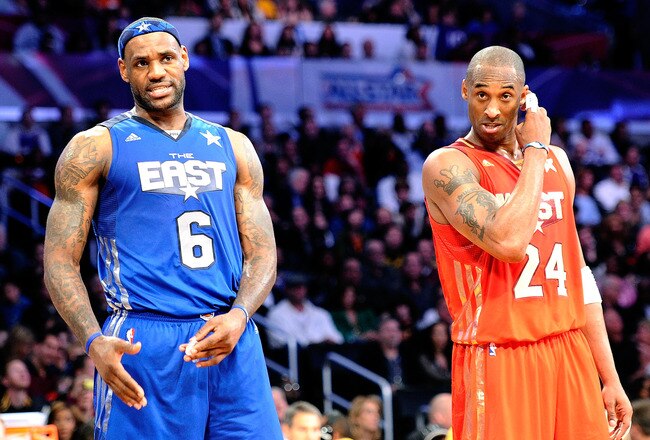 LOS ANGELES, CA - FEBRUARY 20:  LeBron James #6 of the Miami Heat and the Eastern Conference stands with Kobe Bryant #24 of the Los Angeles Lakers and the Western Conference in the 2011 NBA All-Star Game at Staples Center on February 20, 2011 in Los Angeles, California. NOTE TO USER: User expressly acknowledges and agrees that, by downloading and or using this photograph, User is consenting to the terms and conditions of the Getty Images License Agreement.  (Photo by Kevork Djansezian/Getty Images)
