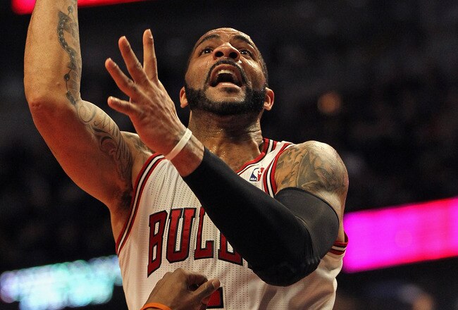 CHICAGO, IL - JANUARY 21: Carlos Boozer #5 of the Chicago Bulls puts up a shot over Tyrus Thomas #12 of the Charlotte Bobcats on his way to a game-high 23 points at the United Center on January 21, 2012 in Chicago, Illinois. The Bulls defeated the Bobcats 95-89. NOTE TO USER: User expressly acknowledges and agrees that, by downloading and or using this photograph, User is consenting to the terms and conditions of the Getty Images License Agreement. (Photo by Jonathan Daniel/Getty Images)
