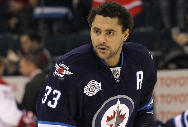 WINNIPEG, CANADA - DECEMBER 22: Dustin Byfuglien #33 of the Winnipeg Jets warms up on the ice before a game against the Montreal Canadiens in NHL action at the MTS Centre on December 22, 2011 in Winnipeg, Manitoba, Canada. (Photo by Marianne Helm/Getty Images)