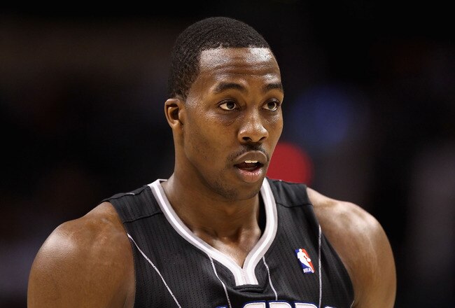 PHOENIX, AZ - MARCH 13:  Dwight Howard #12 of the Orlando Magic during the NBA game against the Phoenix Suns at US Airways Center on March 13, 2011 in Phoenix, Arizona. The Magic defeated the Suns 111-88. NOTE TO USER: User expressly acknowledges and agrees that, by downloading and or using this photograph, User is consenting to the terms and conditions of the Getty Images License Agreement.  (Photo by Christian Petersen/Getty Images)