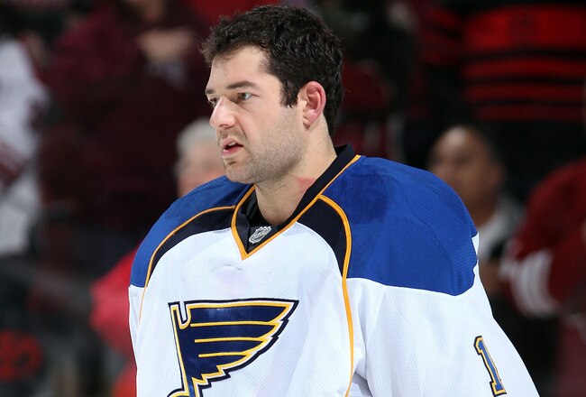 GLENDALE, AZ - DECEMBER 23:  Goaltender Brian Elliott #1 of the St. Louis Blues stands attended for the National Anthem before the NHL game against the Phoenix Coyotes at Jobing.com Arena on December 23, 2011 in Glendale, Arizona. The Blues defeated the Coyotes 3-2.   (Photo by Christian Petersen/Getty Images)