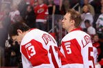 GLENDALE, AZ - JANUARY 19:  Pavel Datsyuk #13 and Nicklas Lidstrom #5 of the Detroit Red Wings stand attended for the National Anthem before the NHL game against the Phoenix Coyotes at Jobing.com Arena on January 19, 2011 in Glendale, Arizona. The Red Wings defeated the Coyotes 3-2 in an overtime shoot out.  (Photo by Christian Petersen/Getty Images)