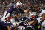FOXBORO, MA - JANUARY 22:  Tom Brady #12 of the New England Patriots dives into the end zone to score a touchdown in the fourth quarter against the Baltimore Ravens during their AFC Championship Game at Gillette Stadium on January 22, 2012 in Foxboro, Massachusetts.  (Photo by Elsa/Getty Images)