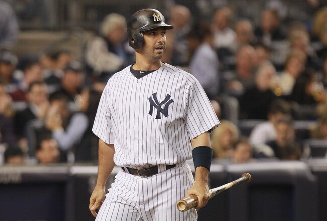 NEW YORK, NY - OCTOBER 06:  Jorge Posada #20 of the New York Yankees reacts after Posada struck out looking to end the bottom of the second inning against the Detroit Tigers during Game Five of the American League Championship Series at Yankee Stadium on October 6, 2011 in the Bronx borough of New York City.  (Photo by Nick Laham/Getty Images)