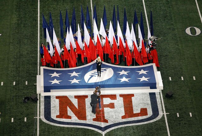 ARLINGTON, TX - FEBRUARY 06:  Singer Christina Aguilera sings the national anthem during Super Bowl XLV at Cowboys Stadium on February 6, 2011 in Arlington, Texas.  (Photo by Tom Pennington/Getty Images)