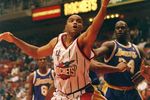 14 Nov 1997: Forward Charles Barkley of the Houston Rockets (center) goes after the ball between center Shaquille O''Neal and guard Eddie Jones of the Los Angeles Lakers during a game at the Compaq Center in Houston, Texas. The Lakers won the game 113-103