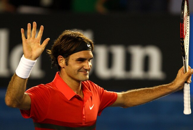MELBOURNE, AUSTRALIA - JANUARY 22:  Roger Federer of Switzerland thanks the crowd after winning his fourth round match against  Bernard Tomic of Australia during day seven of the 2012 Australian Open at Melbourne Park on January 22, 2012 in Melbourne, Australia.  (Photo by Mark Dadswell/Getty Images)