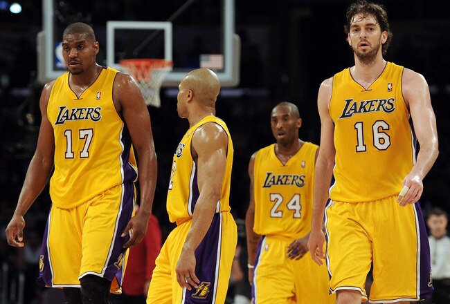 LOS ANGELES, CA - FEBRUARY 03:  Pau Gasol #16, Andrew Bynum #17, Kobe Bryant #24 and Derek Fisher #2 of the Los Angeles Lakers head to the bench after a time out trailing the San Antonio Spurs during the second half at Staples Center on February 3, 2011 in Los Angeles, California.  NOTE TO USER: User expressly acknowledges and agrees that, by downloading and or using this photograph, User is consenting to the terms and conditions of the Getty Images License Agreement.  (Photo by Harry How/Getty Images)