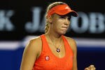 MELBOURNE, AUSTRALIA - JANUARY 22:  Caroline Wozniacki of Denmark celebrates winning a point in her fourth round match against Jelena Jankovic of Serbia during day seven of the 2012 Australian Open at Melbourne Park on January 22, 2012 in Melbourne, Australia.  (Photo by Mark Dadswell/Getty Images)