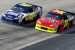 DOVER, DE - MAY 15: Jimmie Johnson, driver of the #48 Lowe's Chevrolet, races Jeff Gordon, driver of the #24 Dupont Chevrolet, during the NASCAR Sprint Cup Series FedEx 400 Benefiting Autism Speaks at Dover International Speedway on May 15, 2011 in Dover, Delaware.  (Photo by Geoff Burke/Getty Images for NASCAR)