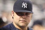 NEW YORK, NY - JUNE 09:  Joba Chamberlain #62 of the New York Yankees watches on from the dugout against the Boston Red Sox on June 9, 2011 at Yankee Stadium in the Bronx borough of New York City.  (Photo by Nick Laham/Getty Images)