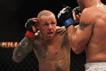 SYDNEY, AUSTRALIA - FEBRUARY 27:  Ross Pearson of Great Britain punches Spencer Fisher of the USA during their Lightweight bout UFC 127 at Acer Arena on February 27, 2011 in Sydney, Australia.  (Photo by Mark Kolbe/Getty Images)