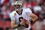 SAN FRANCISCO, CA - JANUARY 14:  Drew Brees #9 of the New Orleans Saints looks to pass from the pocket against the San Francisco 49ers during the NFC Divisional playoff game at Candlestick Park on January 14, 2012 in San Francisco, California. The 49ers won the game 36-32.  (Photo by Jed Jacobsohn/Getty Images)