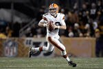 PITTSBURGH, PA - DECEMBER 08:  Colt McCoy #12 of the Cleveland Browns rolls out of the pocket in the first half against the Pittsburgh Steelers at Heinz Field on December 8, 2011 in Pittsburgh, Pennsylvania.  (Photo by Jared Wickerham/Getty Images)