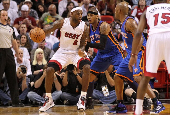 MIAMI, FL - FEBRUARY 27:  LeBron James #6 of the Miami Heat is guarded by Carmelo Anthony #7 of the New York Knicks looks on during a game at American Airlines Arena on February 27, 2011 in Miami, Florida. NOTE TO USER: User expressly acknowledges and agrees that, by downloading and/or using this Photograph, User is consenting to the terms and conditions of the Getty Images License Agreement.  (Photo by Mike Ehrmann/Getty Images)