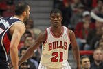 CHICAGO, IL - JANUARY 03:  Jimmy Butler #21 of the Chicago Bulls sets to defend against the Atlanta Hawks at the United Center on January 3, 2012 in Chicago, Illinois. The Bulls defeated the Hawks 76-74. NOTE TO USER: User expressly acknowledges and agrees that, by downloading and or using this photograph, User is consenting to the terms and conditions of the Getty Images License Agreement.  (Photo by Jonathan Daniel/Getty Images)