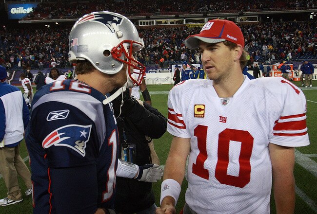 FOXBORO, MA - NOVEMBER 6:    Tom Brady #12 of the New England Patriots congratulates  Eli Manning #10 of the New York Giants after the New York Giants 24-20 win on November 6, 2011 in Foxboro, Massachusetts. (Photo by Jim Rogash/Getty Images)