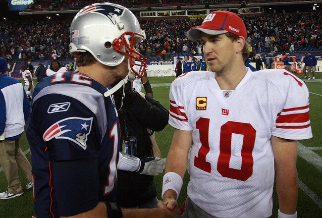 FOXBORO, MA - NOVEMBER 6:    Tom Brady #12 of the New England Patriots congratulates  Eli Manning #10 of the New York Giants after the New York Giants 24-20 win on November 6, 2011 in Foxboro, Massachusetts. (Photo by Jim Rogash/Getty Images)