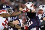 FOXBORO, MA - NOVEMBER 06:   Michael Boley #59 of the New York Giants knocks the ball out of the hands of Tom Brady #12 of the New England Patriots  on November 6, 2011 at Gillette Stadium in Foxboro, Massachusetts.  (Photo by Elsa/Getty Images)