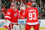 DETROIT, MI - JANUARY 23:  Johan Franzen #93 of the Detroit Red Wings celebrates a win over the St. Louis Blues with teammate Jimmy Howard #35 during their NHL game at Joe Louis Arena on January 23, 2012 in Detroit, Michigan.  (Photo by Dave Sandford/Getty Images)
