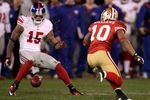 SAN FRANCISCO, CA - JANUARY 22:  Kyle Williams #10 of the San Francisco 49ers fumbles the ball on a punt return in overtime against Devin Thomas #15 of the New York Giants during the NFC Championship Game at Candlestick Park on January 22, 2012 in San Francisco, California.  (Photo by Ezra Shaw/Getty Images)