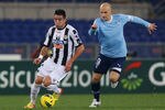 ROME, ITALY - DECEMBER 18:  Mauricio Isla (L) of Udinese Calcio competes for the ball with Tommaso Rocchi of SS Lazio during the Serie A match between SS Lazio and Udinese Calcio at Stadio Olimpico on December 18, 2011 in Rome, Italy.  (Photo by Paolo Bruno/Getty Images)