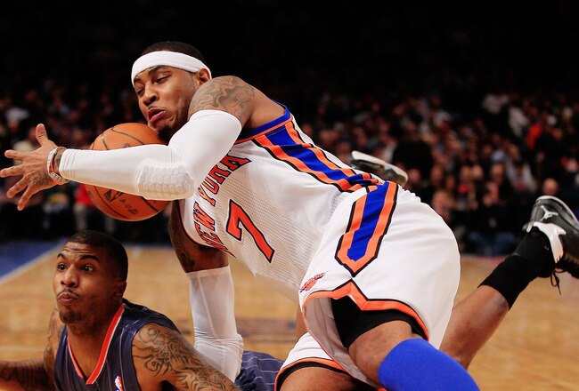 NEW YORK, NY - JANUARY 09:  Carmelo Anthony #7 of the New York Knicks competes for a loose ball with Tyrus Thomas #12 of the Charlotte Bobcats at Madison Square Garden on January 9, 2012 in New York City. NOTE TO USER: User expressly acknowledges and agrees that, by downloading and or using this photograph, User is consenting to the terms and conditions of the Getty Images License Agreement.  (Photo by Chris Trotman/Getty Images)