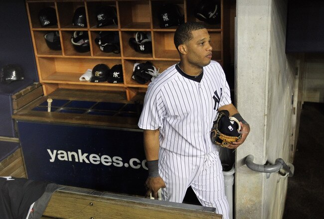 NEW YORK, NY - OCTOBER 06:  Robinson Cano #24 of the New York Yankees walks out of the dugout dejected towards the locker room after they lost 3-2 agaisnt the Detroit Tigers during Game Five of the American League Championship Series at Yankee Stadium on October 6, 2011 in the Bronx borough of New York City.  (Photo by Nick Laham/Getty Images)
