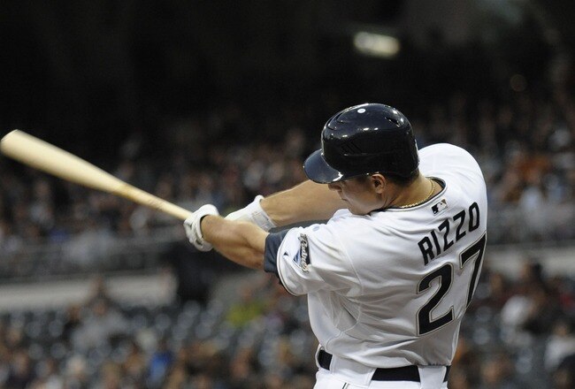 SAN DIEGO, CA - JUNE 28:  Anthony Rizzo #27 of the San Diego Padres hits a double during the fourth inning of a baseball game against the Kansas City Royals at Petco Park on June 28, 2011 in San Diego, California.  The Padres won 4-2. (Photo by Denis Poroy/Getty Images)