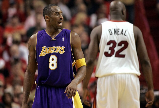 MIAMI - DECEMBER 25:  Shaquille O'Neal #32 of the Miami Heat shows his back to Kobe Bryant #8 of the Los Angeles Lakers on December 25, 2005 at the American Airlines Arena in Miami, Florida. The Heat defeated the Lakers 97-92.  NOTE TO USER: User expressly acknowledges and agrees that, by downloading and/or using this photograph, User is consenting to the terms and conditions of the Getty Images License Agreement.  (Photo by Eliot J. Schechter/Getty Images)