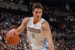DENVER, CO - JANUARY 13:  Danilo Gallinari #8 of the Denver Nuggets controls the ball against the Miami Heat at the Pepsi Center on January 13, 2012 in Denver, Colorado. The Nuggets defeated the Heat 117-104. NOTE TO USER: User expressly acknowledges and agrees that, by downloading and or using this photograph, User is consenting to the terms and conditions of the Getty Images License Agreement.  (Photo by Doug Pensinger/Getty Images)