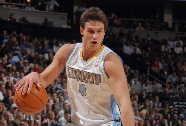 DENVER, CO - JANUARY 13:  Danilo Gallinari #8 of the Denver Nuggets controls the ball against the Miami Heat at the Pepsi Center on January 13, 2012 in Denver, Colorado. The Nuggets defeated the Heat 117-104. NOTE TO USER: User expressly acknowledges and agrees that, by downloading and or using this photograph, User is consenting to the terms and conditions of the Getty Images License Agreement.  (Photo by Doug Pensinger/Getty Images)