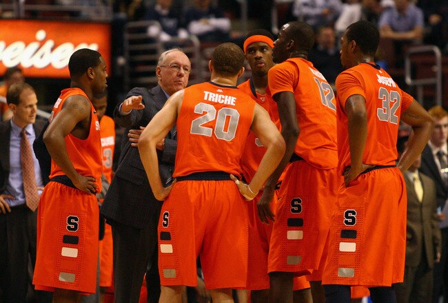 PHILADELPHIA, PA - JANUARY 11:  Head coach Jim Boeheim of the Syracuse Orange talks with (in uniform L-R) Scoop Jardine #11, Brandon Triche #20, C.J. Fair #5, Baye Moussa Keita #12 and Kris Joseph #32 during a timeout against the Villanova Wildcats at the Wells Fargo Center on January 11, 2012 in Philadelphia, Pennsylvania.  (Photo by Chris Chambers/Getty Images)