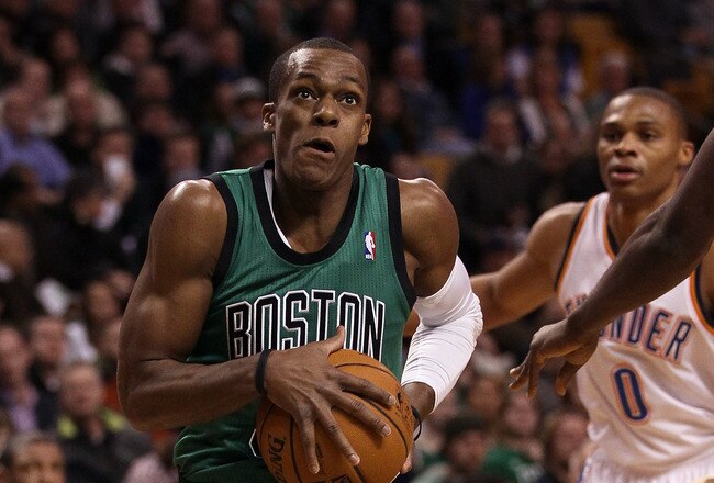 BOSTON, MA - JANUARY 16:  Rajon Rondo #9 of the Boston Celtics heads for the net as Russell Westbrook #0 of the Oklahoma City Thunder defends on January 16, 2012 at TD Garden in Boston, Massachusetts. NOTE TO USER: User expressly acknowledges and agrees that, by downloading and or using this photograph, User is consenting to the terms and conditions of the Getty Images License Agreement.  (Photo by Elsa/Getty Images)