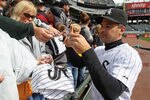 CHICAGO, IL - SEPTEMBER 28: Omar Vizquel #11 of the Chicago White Sox signs autographs before the final game of the 2011 season against the Toronto Blue Jays at U.S. Cellular Field on September 28, 2011 in Chicago, Illinois. (Photo by Jonathan Daniel/Getty Images)